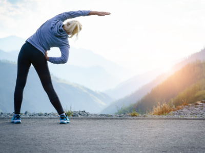 a woman stretching before her running workout