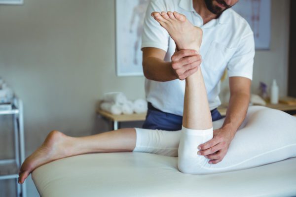 physiotherapist working on a patient