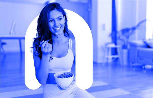 Woman eating healthy meal and the letter "n" for "nutritionist"