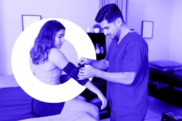Physiotherapist helping woman with injured elbow, and letter "o"