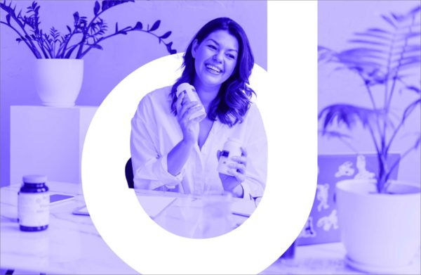 Woman holding vitamins and the letter "d" for "dietitian"