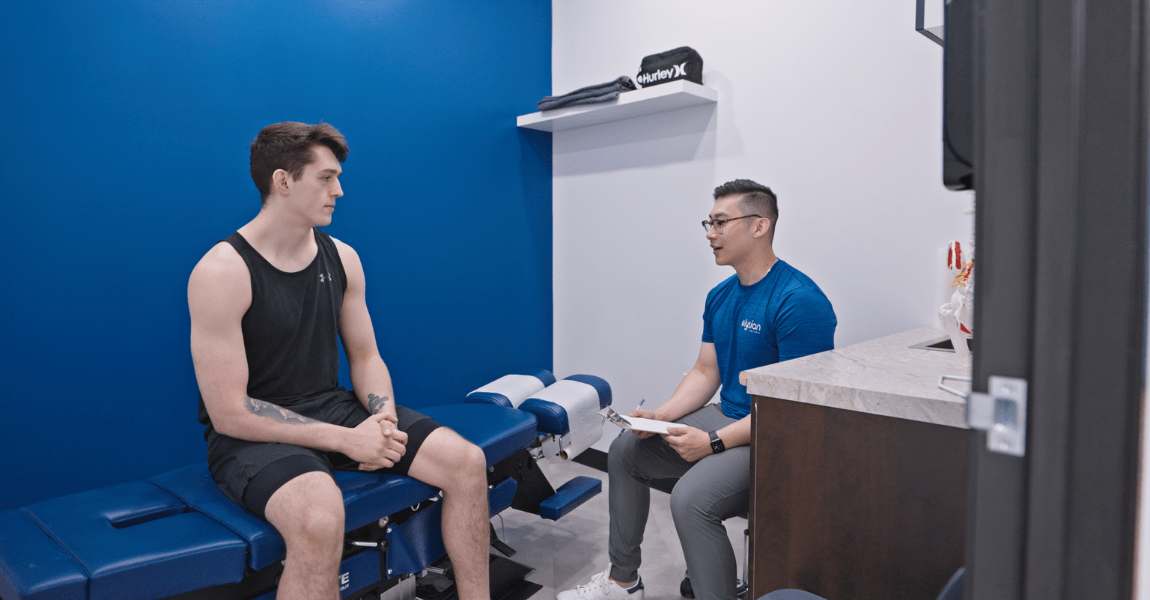 Athlete consulting with a chiropractor for treatment
