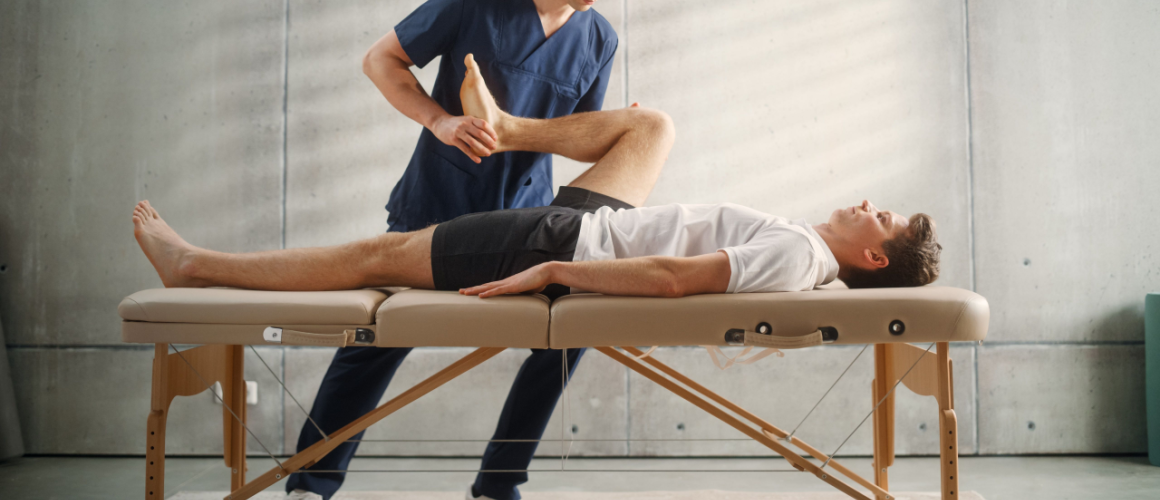 Man in athletic wear getting a physio treatment